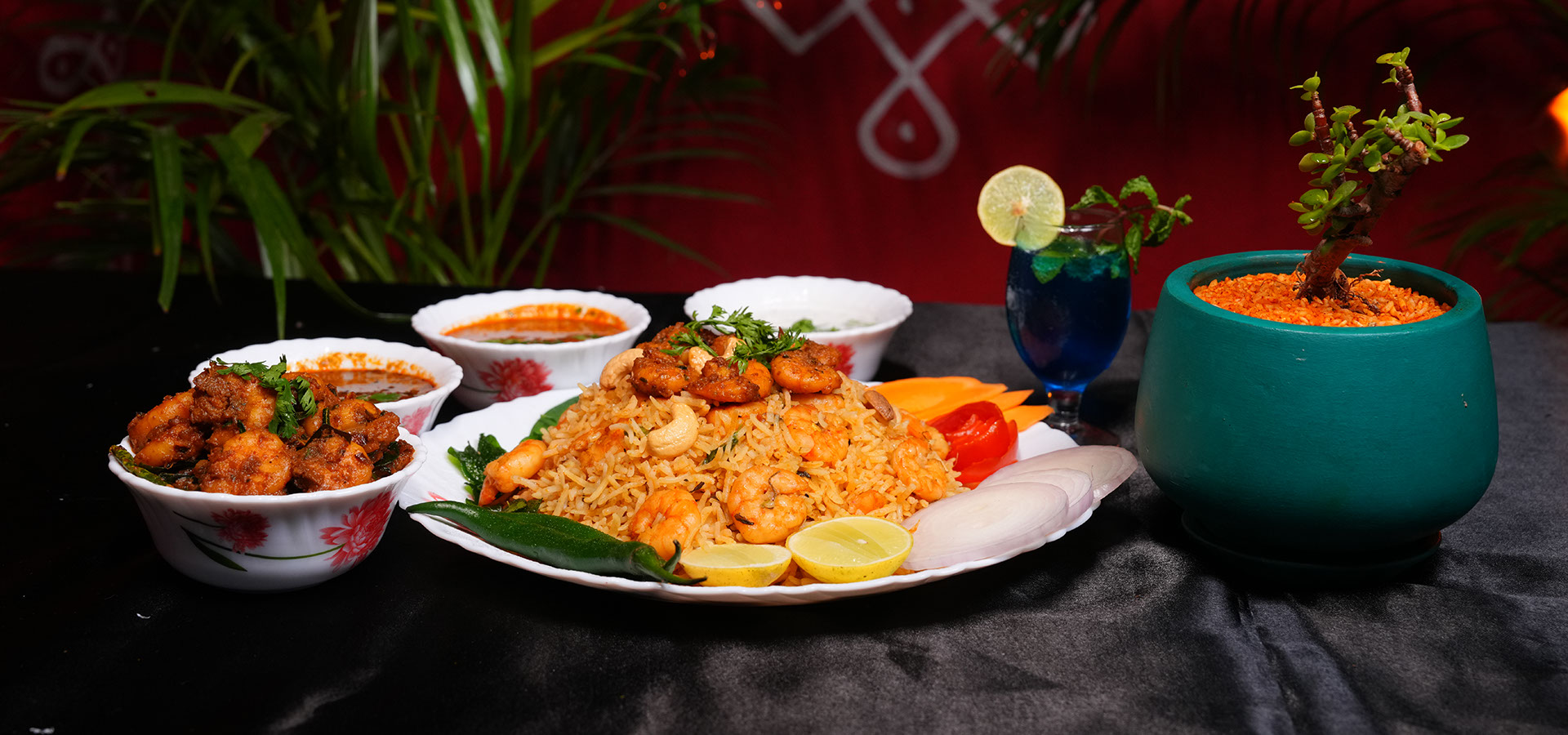 Chittibabu Kodi Pulav Andhra chicken rice served with boiled egg, spicy chicken fry, chutney and drink in a restaurant ambience with fire backgr