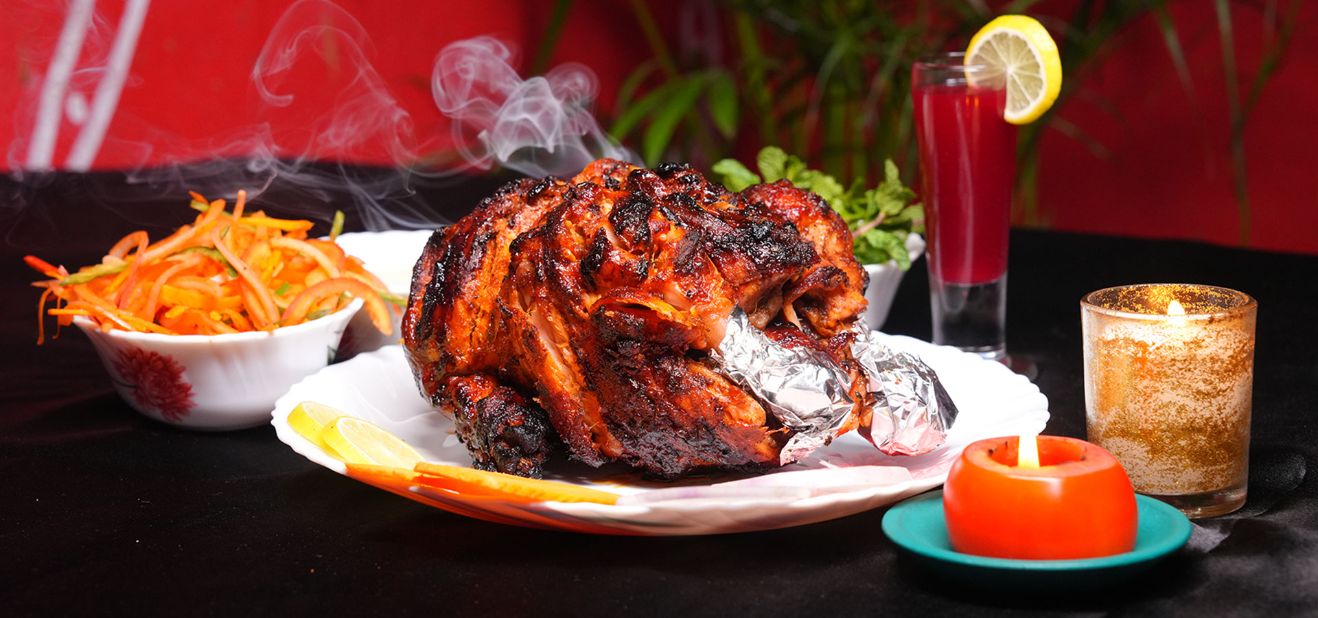 Chittibabu Kodi Pulav Andhra chicken rice served with boiled egg, spicy chicken fry, chutney and drink in a restaurant ambience with fire backgr